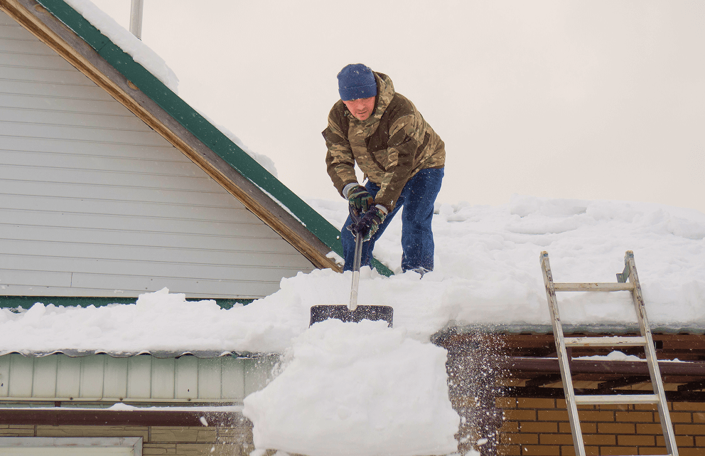 man-removes-snow-from-roof-completely-snowcovered-house-with-shovel-lot-fresh-snow-after-blizzard-hard-dangerous-work 2 (1) (1)